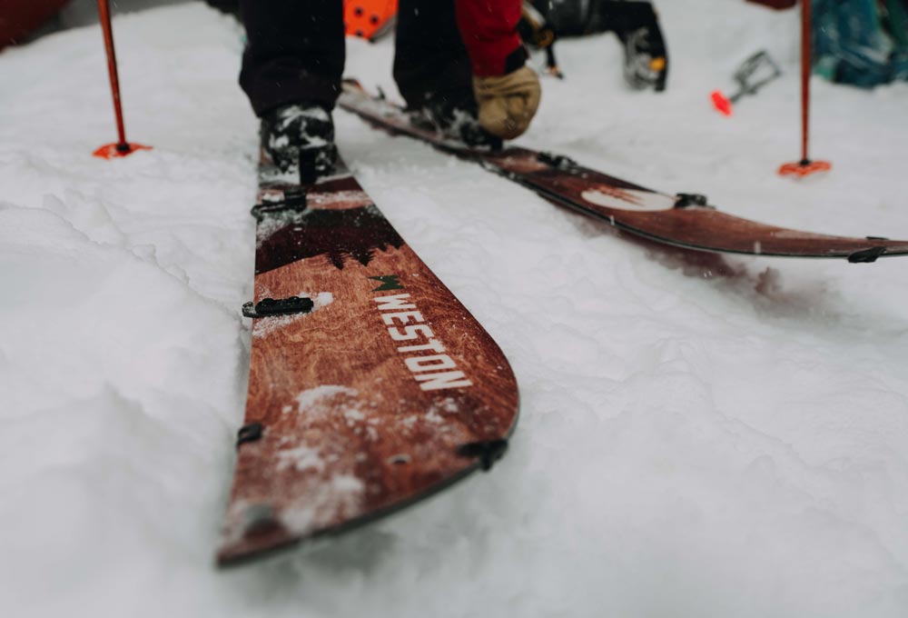 close up image of the weston backwoods splitboard in touring mode on the snowy ground