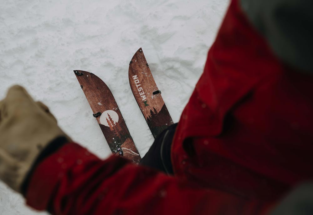 looking down on the weston backwoods splitboard in touring mode on a snowy day