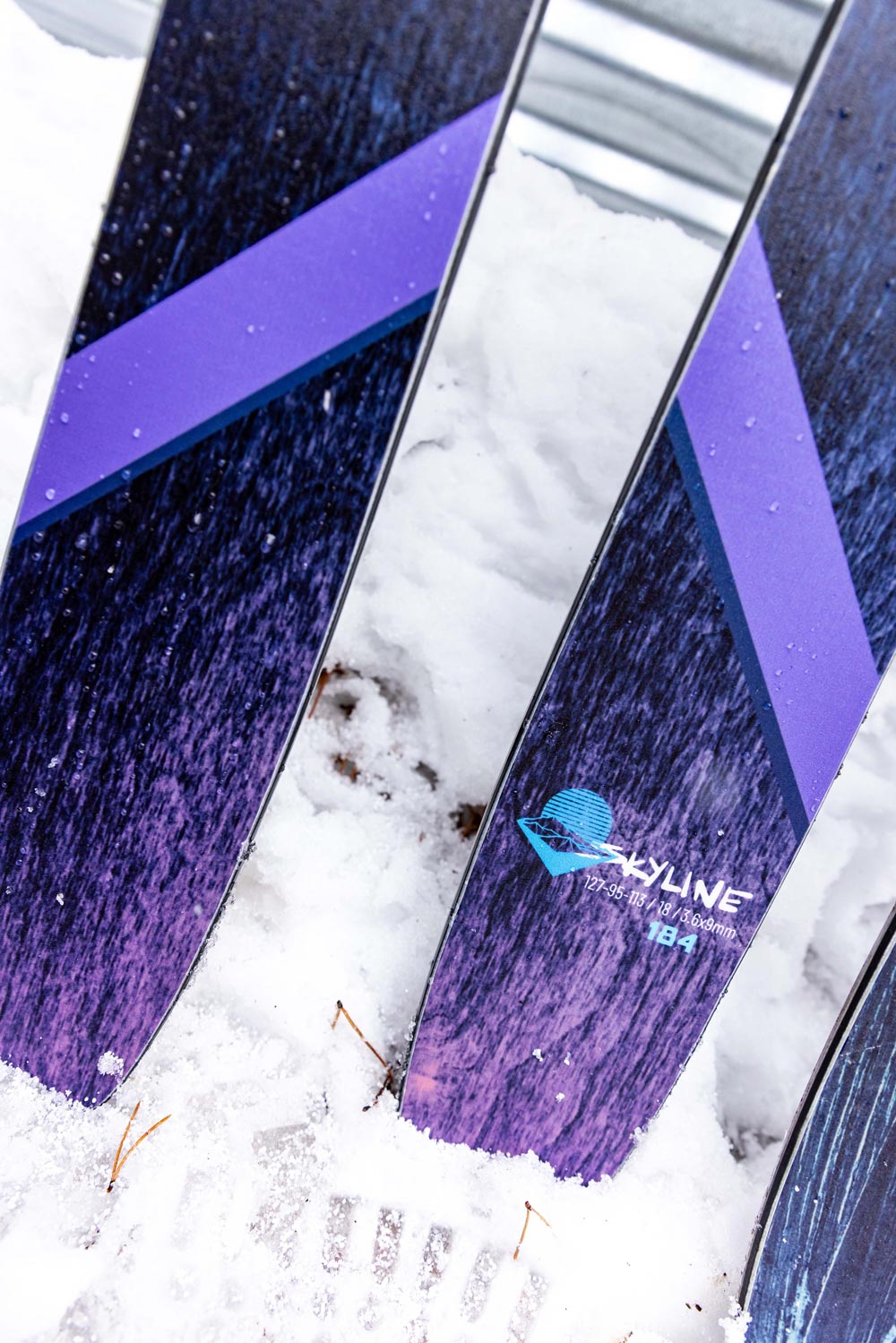 close-up image of the tails of the weston skyline skis in the snow