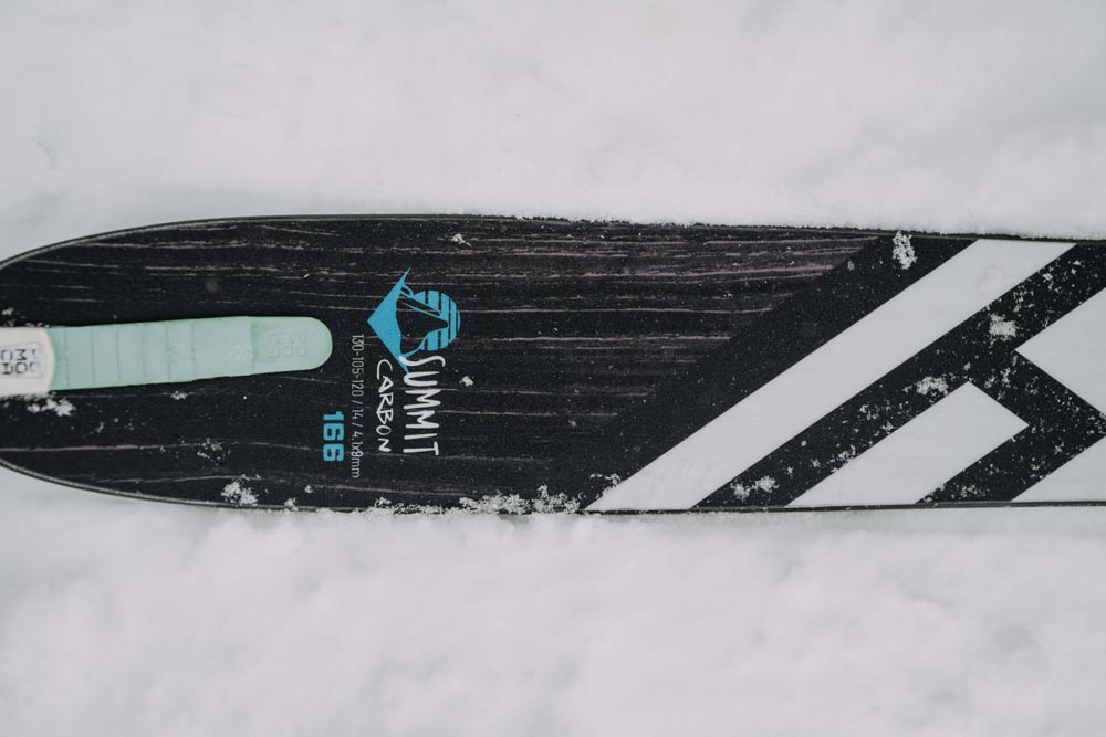 close-up of the tail of a weston summit carbon ski in the snow