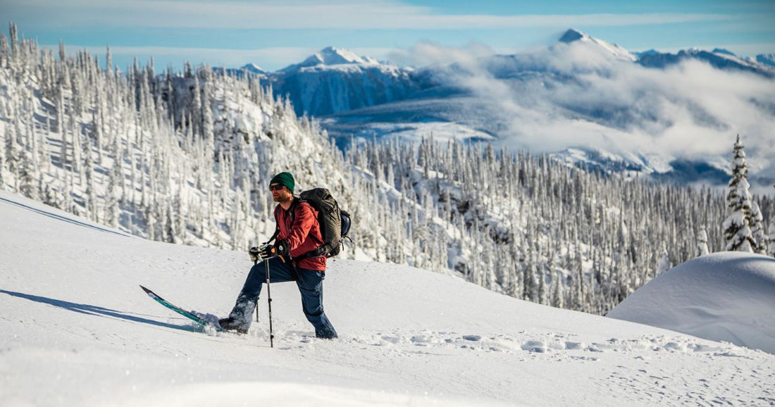 Backcountry Splitboarder on a Weston splitboard touring up a snowy mountain ridge in Revelstoke 